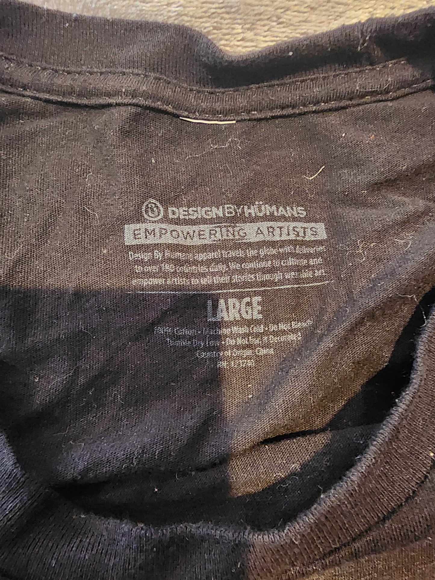 Large Design by Humans Tee